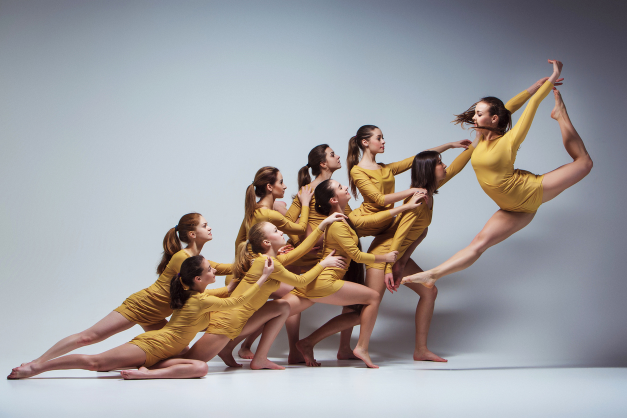 Built By She - The group of modern ballet dancers dancing on gray background
